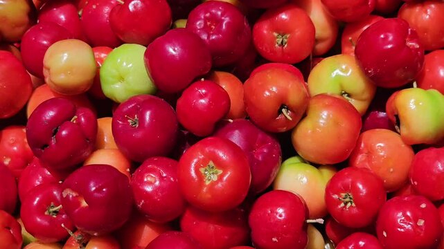 Acerola. Acerola fruit, rich in vitamins. Red fruits piled up