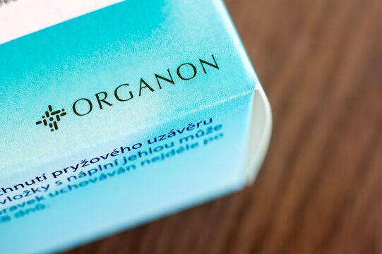 Package of Organon medicaments and cures on table