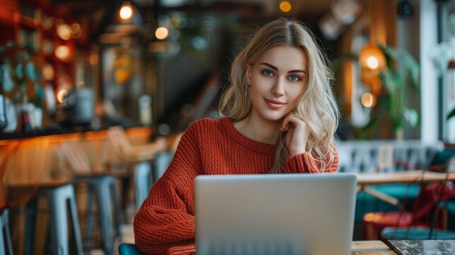 Freelancer working in a cozy cafe while enjoying a remote lifestyle with a laptop and warm atmosphere