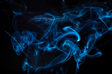 Blue smoke swirls in abstract form, photography style on black background. Concept of mystery and creativity