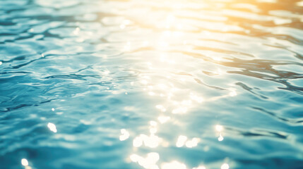 Sunlight reflecting on clear blue water surface with ripples