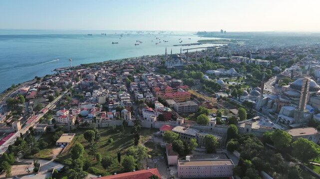 Istanbul, Turkey: Aerial view of famous Turkish city straddling Bosphorus Strait, summer day with clear blue sky - landscape panorama of Europe / Asia from above
