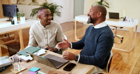 Happy, businessmen and handshake with laptop for deal, thank you or project agreement at office desk. Male people, African coworkers or shaking hands with mentor for partnership, training or teamwork