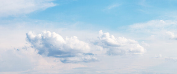Bright blue sky with fluffy white clouds