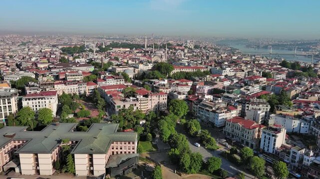 Istanbul, Turkey: Aerial view of famous Turkish city straddling Bosphorus Strait, summer day with clear blue sky - landscape panorama of Europe / Asia from above

