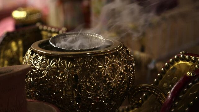 Traditional Arabic incense bukhoor agar wood burner with smoke