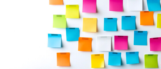 A colorful array of sticky notes arranged on a white background, ideal for brainstorming, organization, or creative projects.