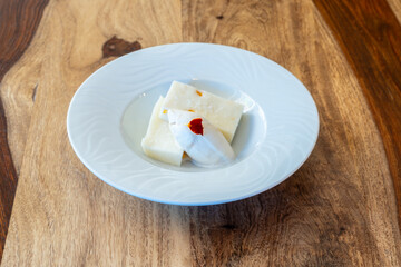 A white plate with a dessert on it