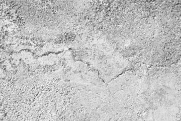Dirty cracked concrete floor texture background. Scratches on wall.