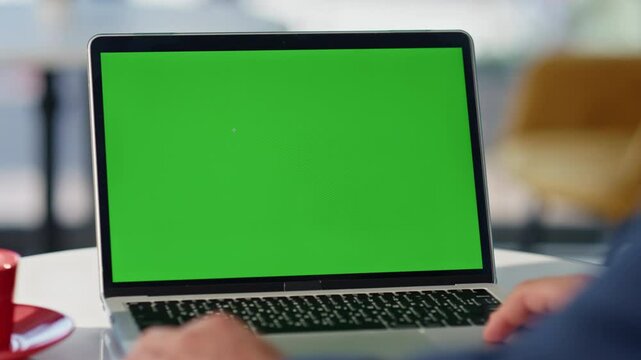 Freelancer browsing website chroma key laptop working restaurant table closeup