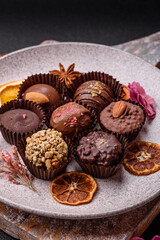 Homemade chocolate candies with different fillings and sprinkles