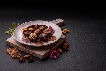 Homemade chocolate candies with different fillings and sprinkles