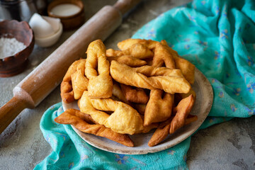 Homemade firewood cookies for breakfast. Sweet firewood cookies for dessert on a gray background. Close-up