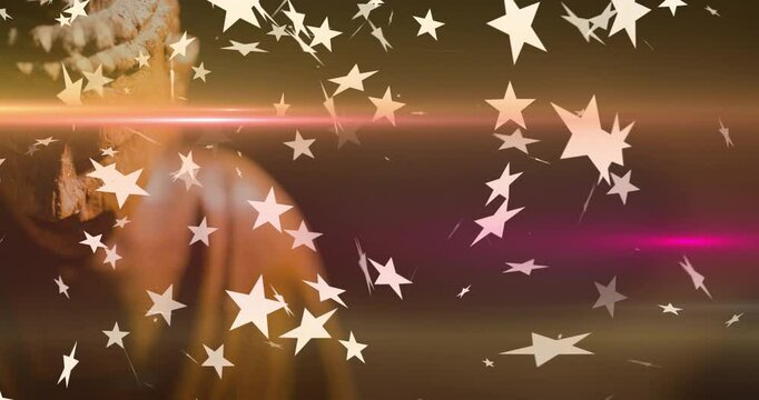 Floating star shapes over warm background with partially visible Buddha statue