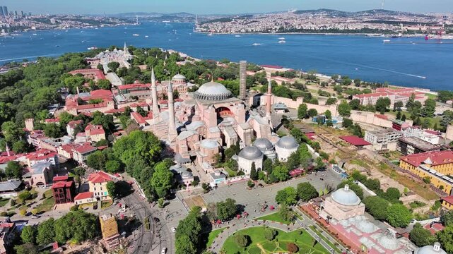 Istanbul, Turkey: Aerial view of largest Turkish city, famous historic landmark Hagia Sophia Grand Mosque, summer day with clear blue sky - landscape panorama of Europe / Asia from above
