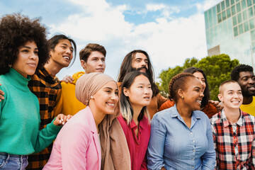 Diverse group of young people having fun with city on background in summer vacations. Youth community of students - Life style concept
