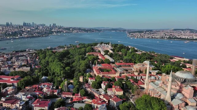 Istanbul, Turkey: Aerial view of largest Turkish city, famous historic landmark and museum Topkapi Palace (Topkapı Sarayı), sunny summer day - landscape panorama of Europe / Asia from above
