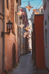Fototapeta premium The narrowest street in Riga is medieval Rozena Street in the old part of the city. Riga, Latvia.