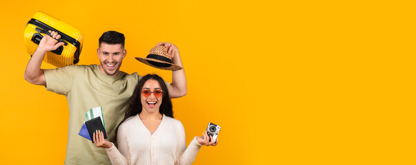 Happy glad millennial arabic husband and wife with hat, suitcase, photo camera and tickets rejoice...