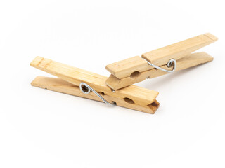 Two Wooden Clothespins Isolated on a White Background