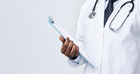 Cropped of african doctor with medical folder over white studio background
