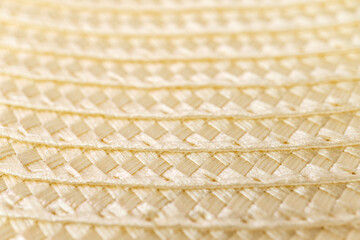Close-up texture of woven straw material in soft light