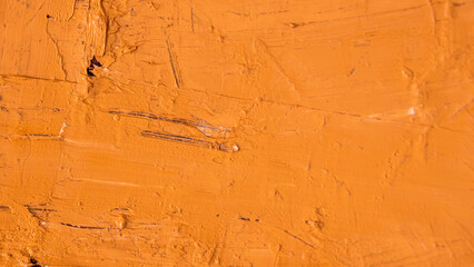 Ochre-coloured paint texture in different shades of colour