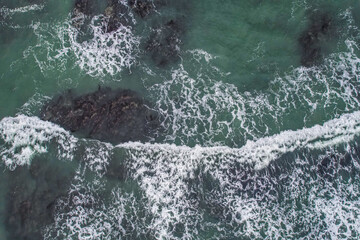 Obraz premium Aerial, Winter’s crashing tidal waves at Down Derry in Cornwall UK