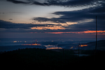 Orange sunrise with blue hour colors monastery near valley of river Donau
