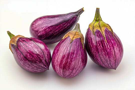 A group of three purple eggplants sitting on top of each other