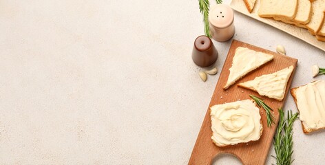 Tasty toasts with processed cheese on light background with space for text, top view