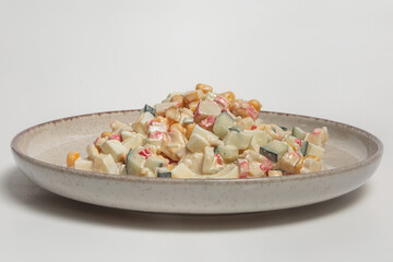 The image shows a plate of mixed vegetable salad. 