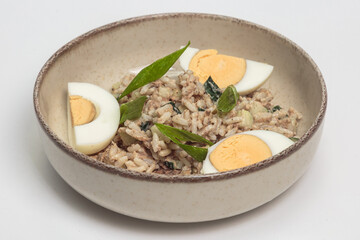 The image shows a bowl of what appears to be a rice-based dish, possibly a risotto or a creamy rice preparation.