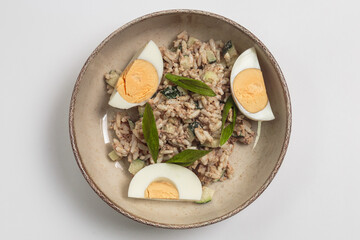 The image shows a bowl of what appears to be a rice-based dish, possibly a risotto or a creamy rice preparation. 