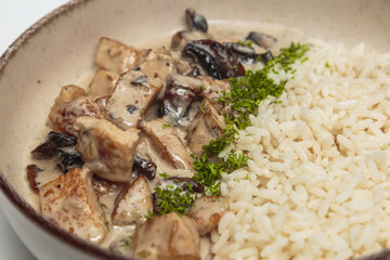 The image shows a bowl containing a savory dish. 