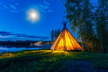 tribal teepee: The life of nomadic tribes, Forest home of the Indians,  tipi, Wigwam with moonlight. 
