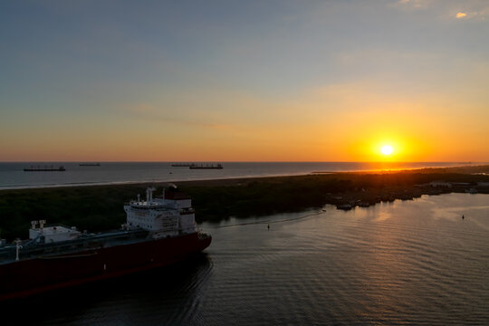 Sunset with bright sun at the cruise port of Quetzal, Guatemala.