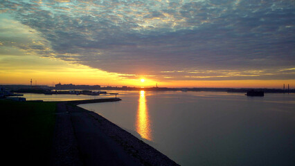 Aerial view on sunrise over sea shore 