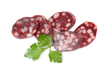 Pieces of delicious dry cured sausage and parsley isolated on white, top view