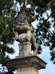 A stone lion sculpture at the entrance to Parco Ciani. Lugano, Switzerland