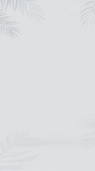 Obraz premium Grey Background with Blurred Palm Leaf Shadow for Elegant and Minimalist Product Display or Branding Design.