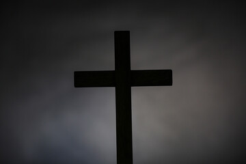 Wooden cross on grey background. Good Friday concept