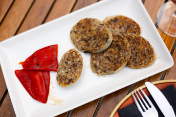 Traditional spanish girella lamb sausage on a plate