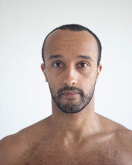 Fototapeta premium Dark-skinned man, head close-up over white background.