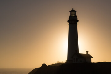 Sunset on a lighthouse, on the edge of a cliff, in Northern California. 