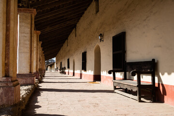 A long porch at a Spanish mission in California.