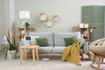 Stylish interior of living room with different appliances. Blurred view