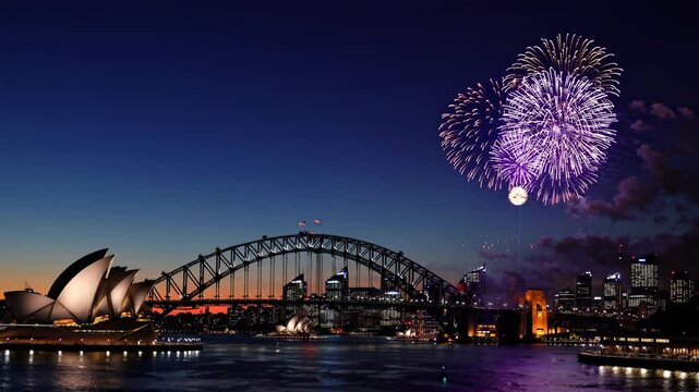 Aerial video captures vibrant fireworks over Sydney Harbour Bridge at dusk, showcasing the Opera House and city skyline in stunning detail.