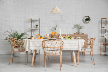 Dining table served with citrus fruits in room
