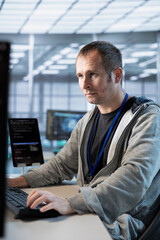 Data center admin developing disaster recovery plans ensuring minimal downtime. Server hub IT...